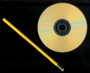 Size comparison: A 12&nbsp;cm Sony DVD+RW and a 19&nbsp;cm pencil.