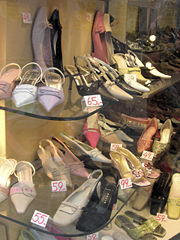 Women's shoes on display in a shop window, 2005.
