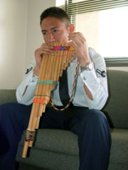 Playing the zampo&ntilde;a, a Pre-Inca instrument and type of pan pipes.