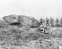Canadian troops advancing behind a British Mark II tank at the Battle of Vimy Ridge.