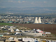 The oil refinery in Haifa, Israel is capable of processing about 9 million tons (66 million barrels) of crude oil a year. Its two cooling towers are landmarks of the city's skyline.