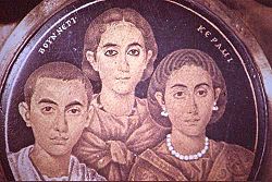 A group portrait depicted on glass, dating from c.250 A.D., showing a mother, son and daughter. It was once considered to be a depiction of the family of Valentinian III.