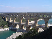 Pont du Gard in France is a Roman aqueduct built in c. 19 BC. It is one of France's top tourist attractions and a World Heritage Site.