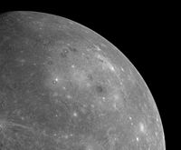 MESSENGER's first image of the unseen side of Mercury from a distance of about 17,000&nbsp;miles (27,000&nbsp;km) cropped to highlight Caloris. The rim is hard to discern as the Sun is directly overhead, preventing shadows.