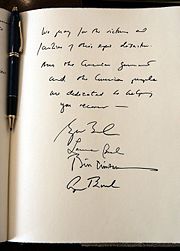 A note signed by former United States Presidents George H. W. Bush and Bill Clinton, First Lady Laura Bush, and President George W. Bush expressing their condolences during a visit to the embassy of Sri Lanka in Washington, D.C., Monday, January 3, 2005. The President wrote, &ldquo;We pray for the victims and families of this epic disaster. And the American government and American people are dedicated to helping you recover.&rdquo;