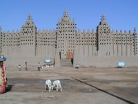 The Great Mosque's signature trio of minarets overlooks the central market of Djenn&eacute;. Unique Malian aesthetic