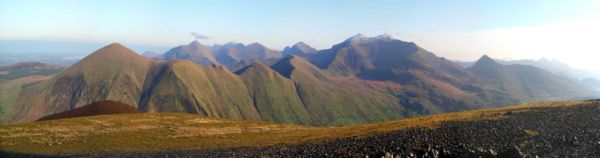 Panorama of some of the Snowdon Massif including Snowdon (centre right) taken from Mynydd Mawr. The Glyderau are visible in the distance.