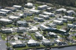 President George W. Bush, aboard Marine One, surveys hurricane damage at a mobile home park in Fort Myers, Florida.