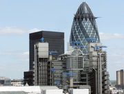 Lloyd&rsquo;s Building, London (with the blue cranes). The Gherkin shaped Swiss Re Tower is in the background