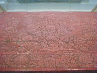 The only surviving piece of furniture from the "Orchard Factory" (the Imperial Lacquer Workshop) set up in Beijing in the early Ming Dynasty. Decorated in dragons and phoenixes, it was made during the Xuande era (1426&ndash;1435). The imperial workshops in the Ming era were overseen by a eunuch bureau. (See closeup for detail)