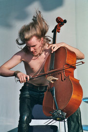 Apocalyptica's Perttu Kivilaakso playing metal music live.