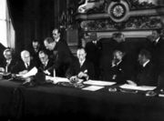 The National Bloc signing the Franco-Syrian Treaty of Independence in Paris in 1936. From left to right: Saadallah al-Jabiri, Jamil Mardam Bey, Hashim al-Atassi (signing), and French Prime Minister L&eacute;on Blum.