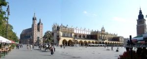 Polish architecture: Main Market Square in Krak&oacute;w. St Mary's Basilica (left), Sukiennice (centre), Town Hall Tower (right)