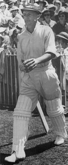 Bradman walking out to bat in the third Test against England at the Melbourne Cricket Ground in 1937. His 270&nbsp;runs won the match for Australia and has been rated the greatest innings of all time.
