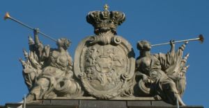 Polish&ndash;Lithuanian Commonwealth coat of arms. Ciołek i.e. Stanislaus II August coat of arms is placed in the middle of the shield. The sculpture is situated on guardhouse in Poznań.