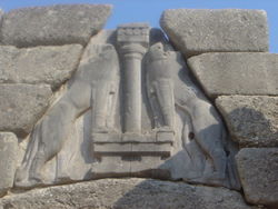The Lion Gate of Mycenae (detail)&mdash;two lionesses flank the central column that represents a goddess&mdash;c. 1300 BC renovation of an existing structure that was demolished to build the new
