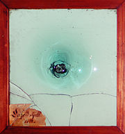 Oldest mouth-blown window-glass from 1742 from Kosta Glasbruk, Sm&aring;land, Sweden. In the middle the mark from the glass blowers pipe