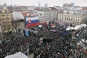 President George W. Bush and Slovakia's former Prime Minister Mikul&aacute;&scaron; Dzurinda are greeted by a crowd of thousands gathered in Bratislava's Hviezdoslavovo Square