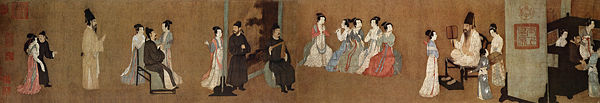 Half-section of the Song Dynasty (960&ndash;1279) version of Night Revels of Han Xizai, original by Gu Hongzhong; the painting shows musicians entertaining guests in a 10th century household. In the center are three female musicians playing guan, two female musicians playing transverse bamboo flutes, and a male musician playing a wooden clapper called paiban.