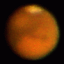 The rotation of Mars as seen in a small telescope in 2003.