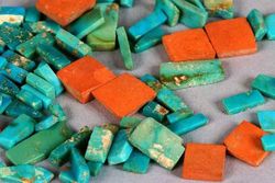 A selection of Ancestral Puebloan (Anasazi) turquoise and orange argillite inlay pieces from Chaco Canyon (dated ca. 1020&ndash;1140 CE) show the typical colour range and mottling of American turquoise.